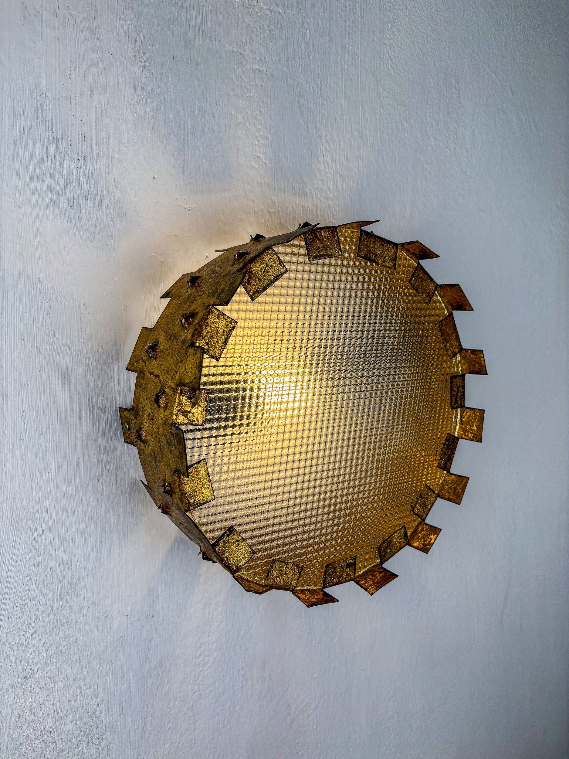 Brutalist crown sunburst fixture in gilt metal and frosted glass, France, 1960s