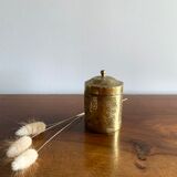 Old round box in chiseled brass