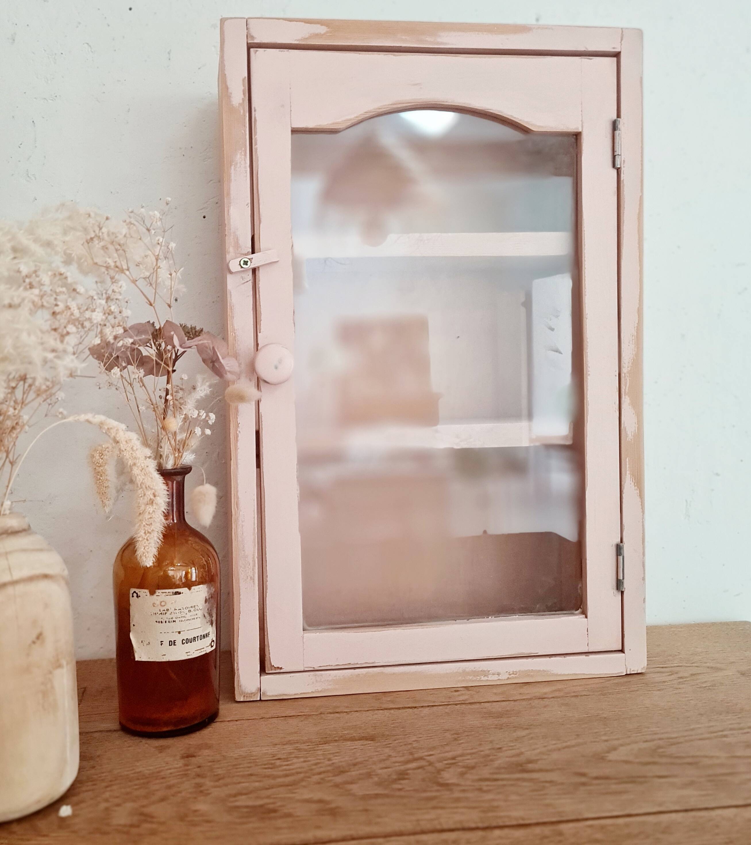 Medicine cabinet in patinated pink wood