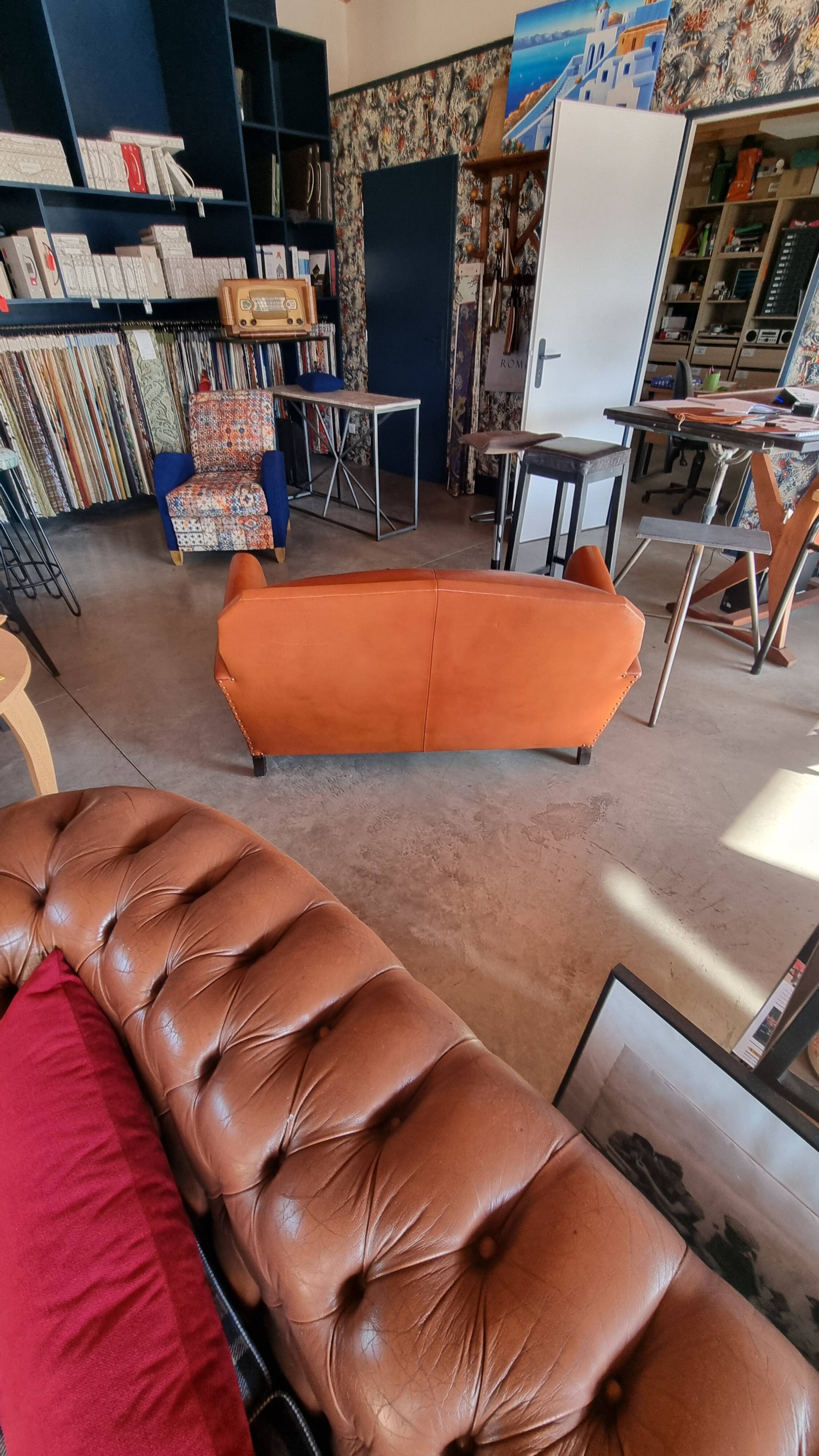 Club sofa in leather and fabric