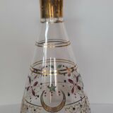 Antique golden carafe with colorful patterns