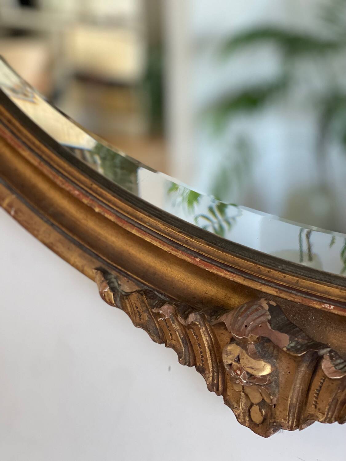Antique oval gilt mirror.