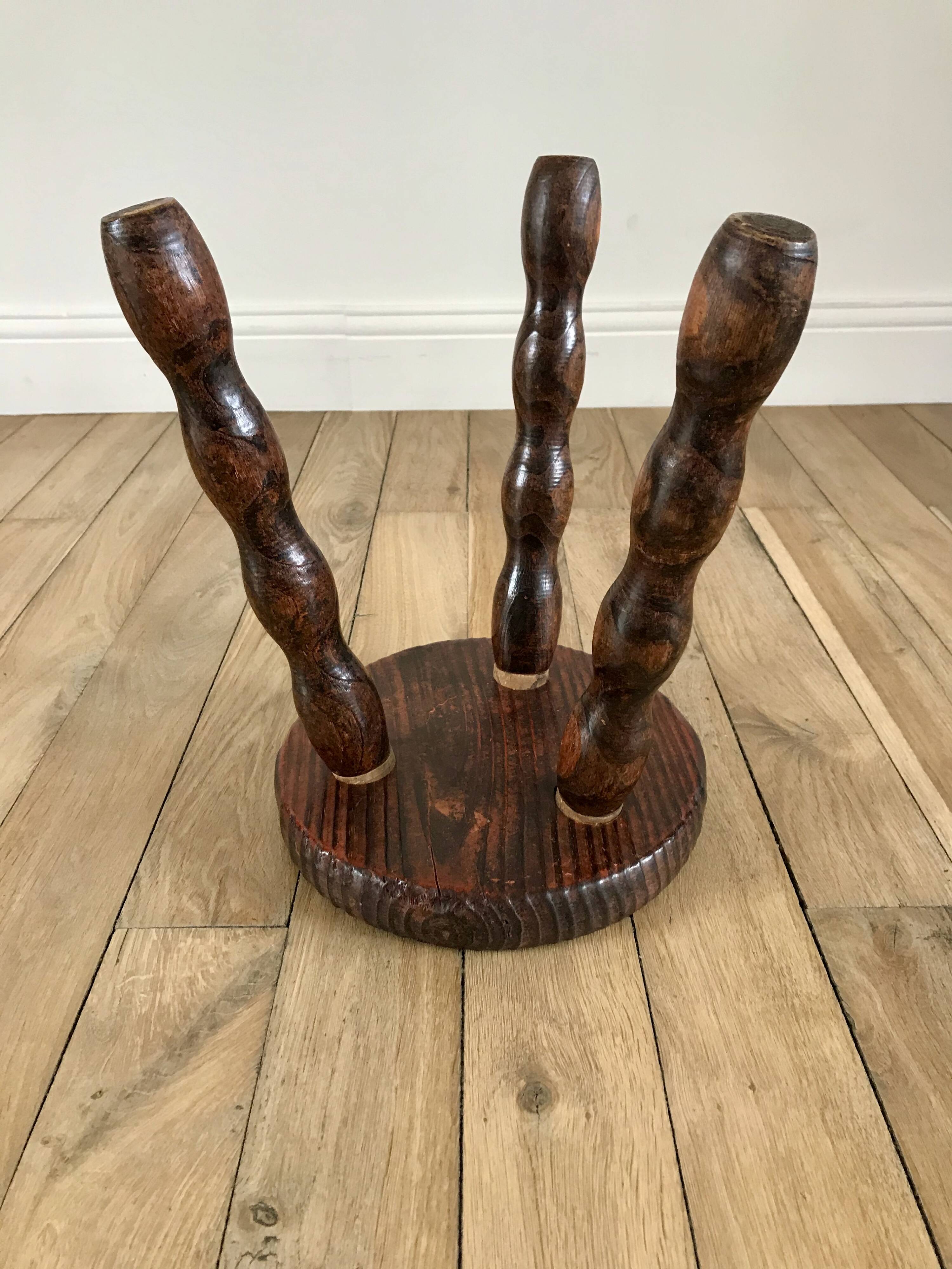 low stool in solid turned wood from the 70s
