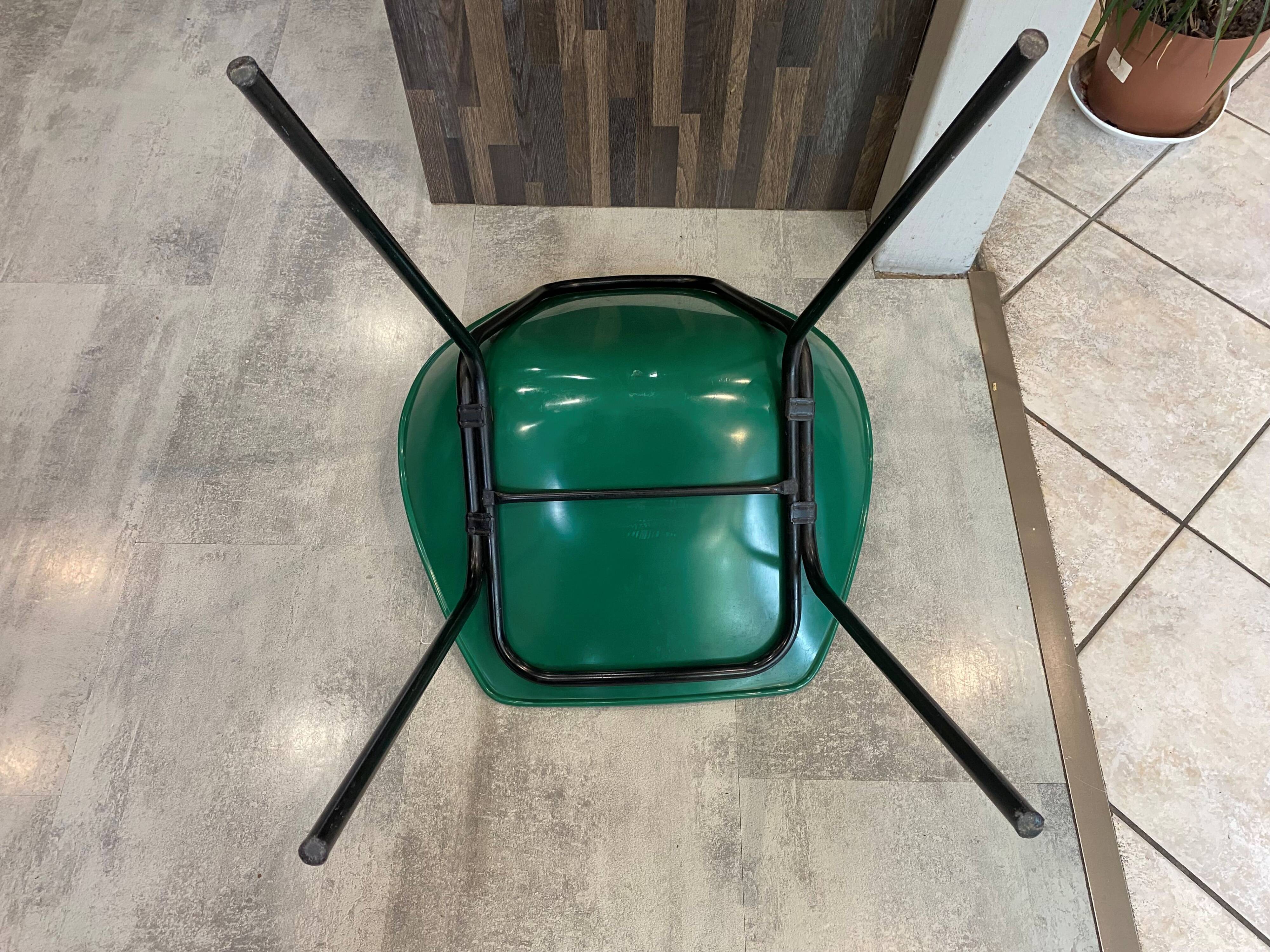 A shell chair by Pierre Guariche for Meurop in vintage green from the 1960s.