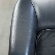 Set of dark blue cow leather club armchairs with a unique design