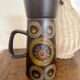 Enamelled ceramic carafe