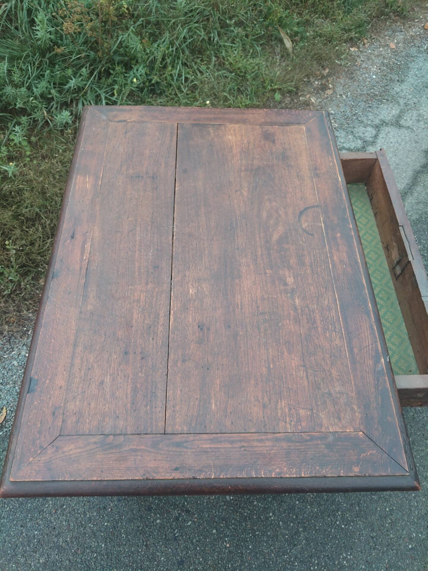 Small antique writing table in Louis XIII style made of oak.