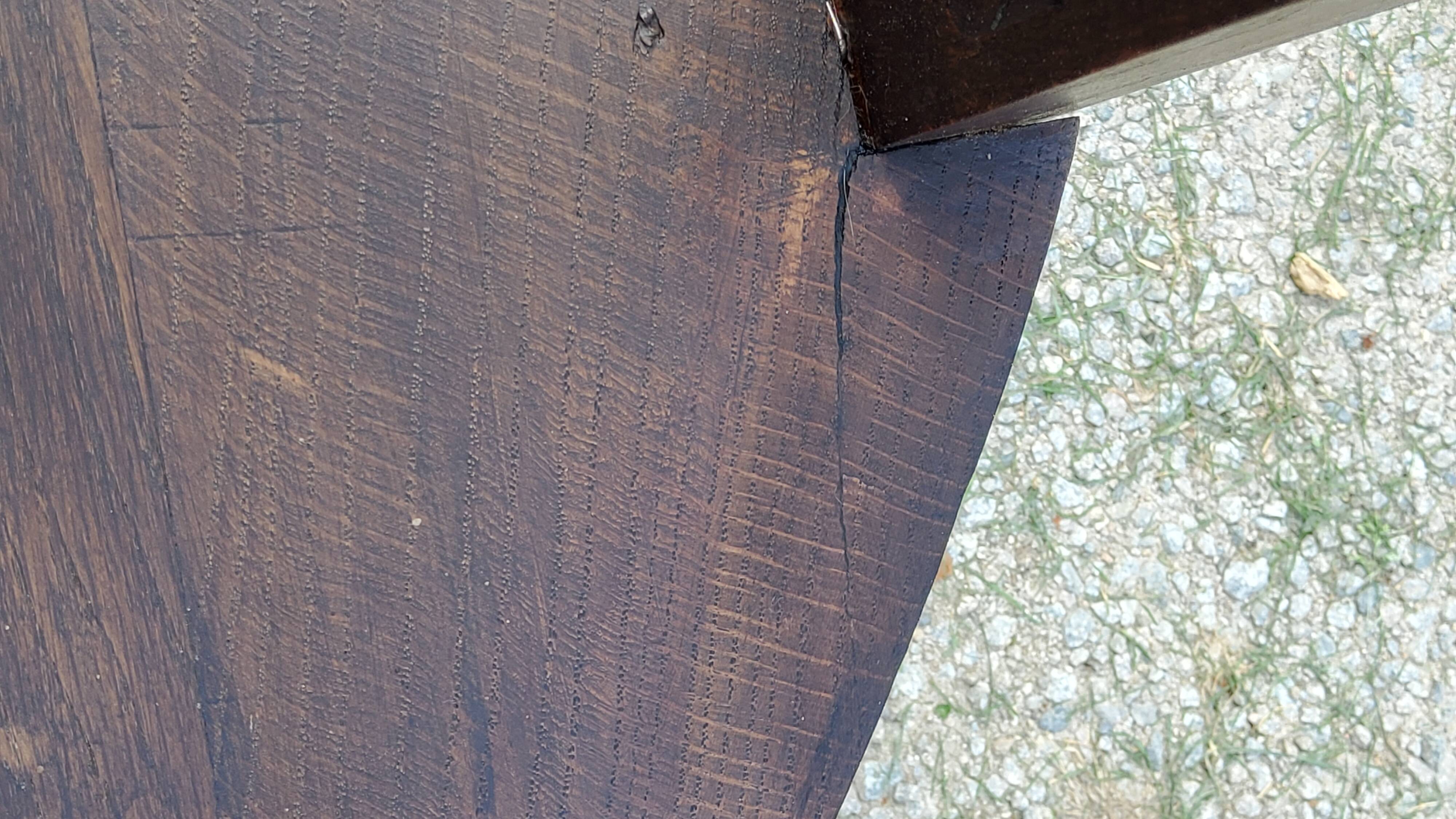 Set of three brutalist tripod armchairs in carved solid oak