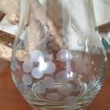 Pitcher decorating grape bunch