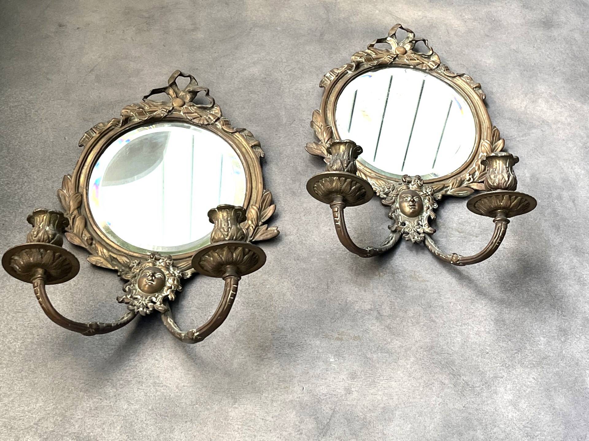 Pair of mirror sconces with bronze candlesticks from the 19th century.