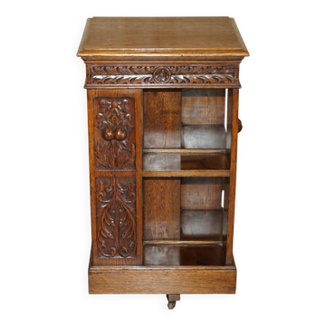 Victorian carved oak revolving library, circa 1880.
