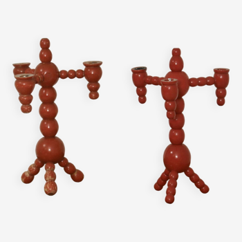 Pair of red wooden candelabra from Sweden 1970