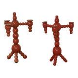 Pair of red wooden candelabra from Sweden 1970