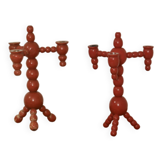 Pair of red wooden candelabra from Sweden 1970