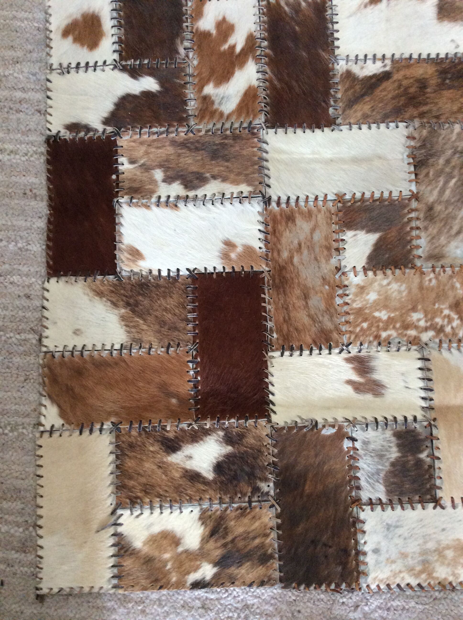 Patchwork carpet in cowhide 164x105cm from the 70s