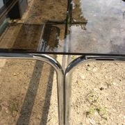 Dining table of the 70s in smoked glass and chromed metal