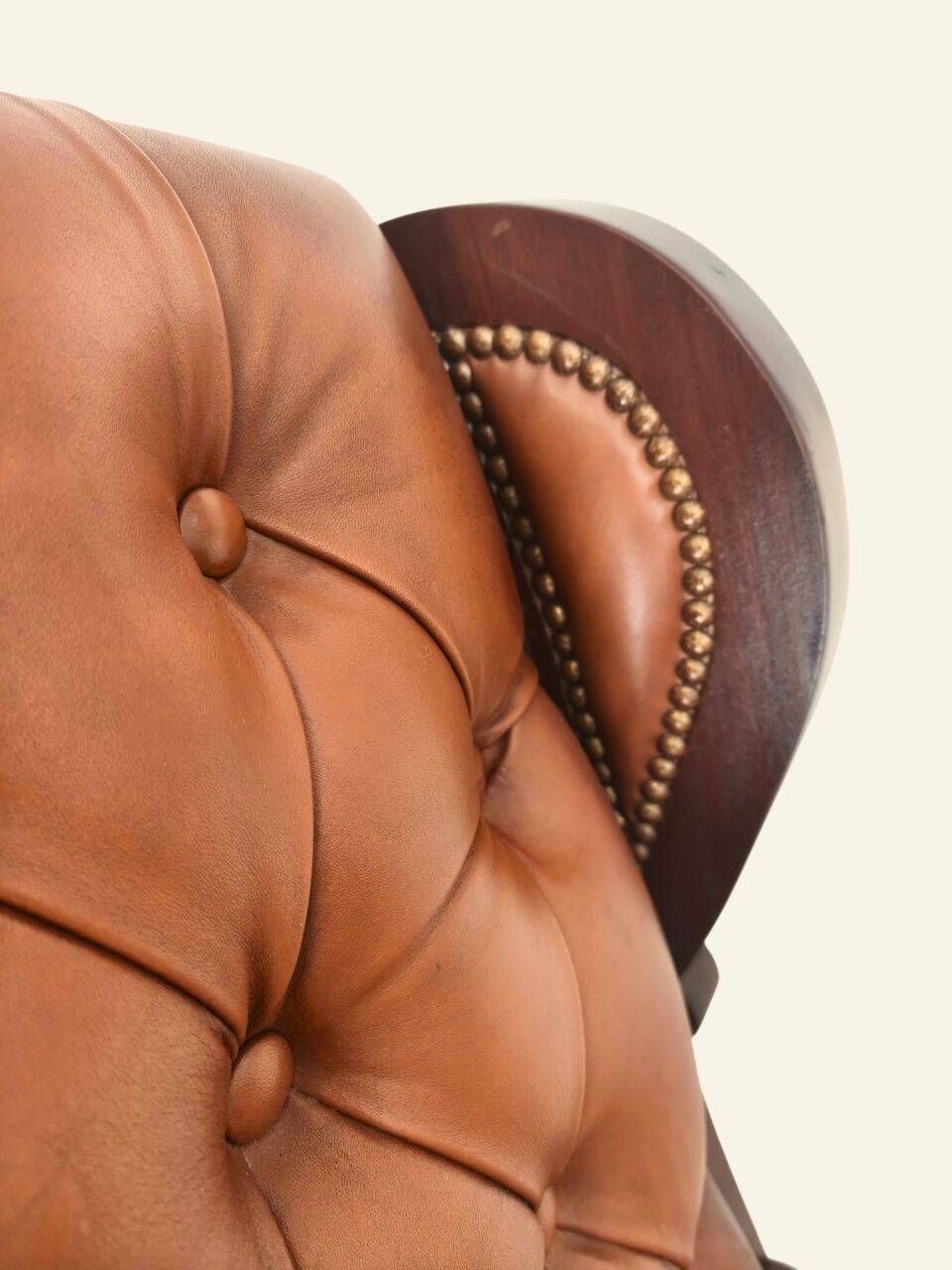 Rocking chair with footrest, wood and tufted leather