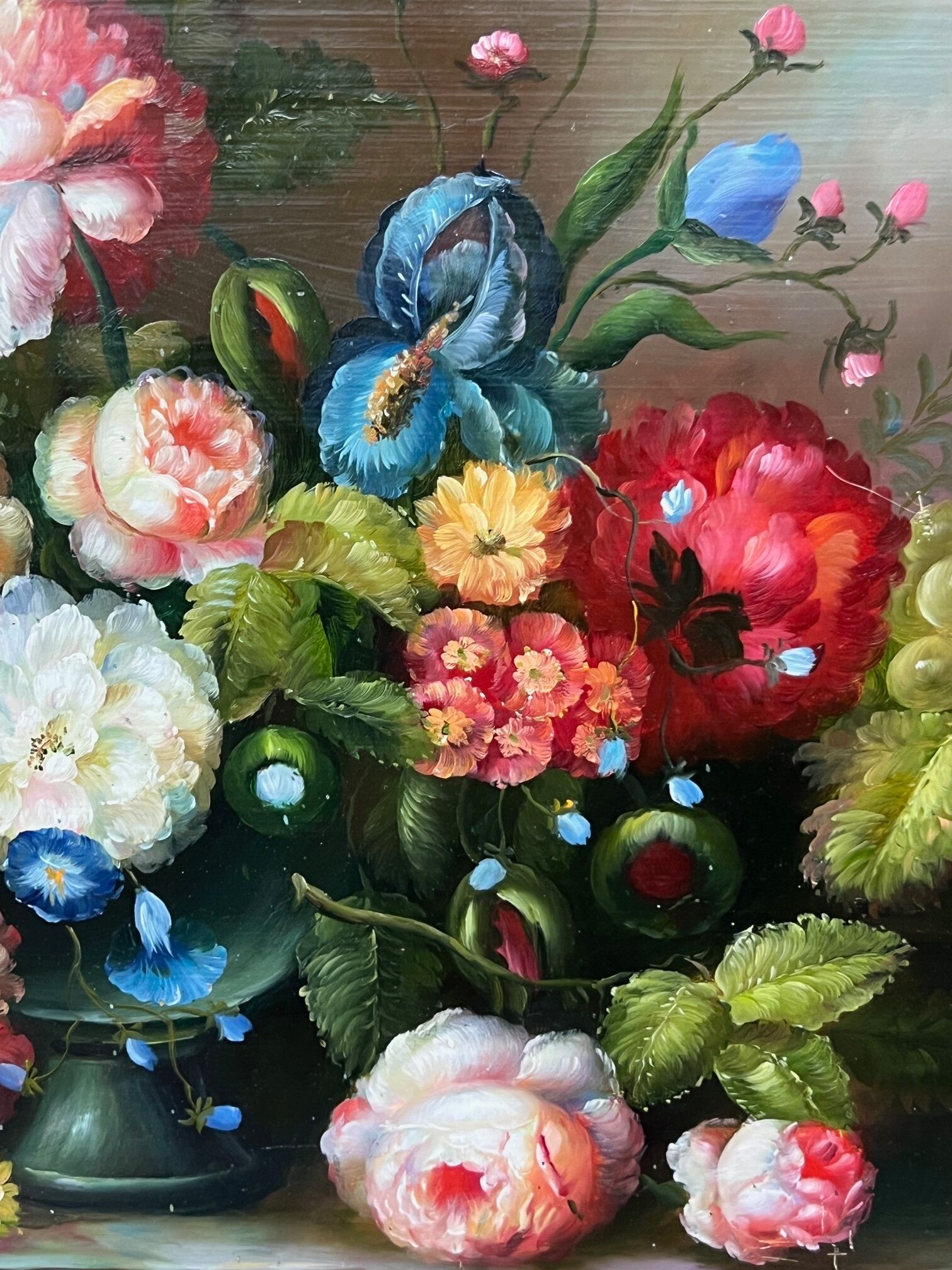 Still life with roses in a beautiful frame on a wooden panel in Flemish style.