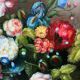 Still life with roses in a beautiful frame on a wooden panel in Flemish style.
