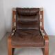 Leather and wood armchair, brutalist style.