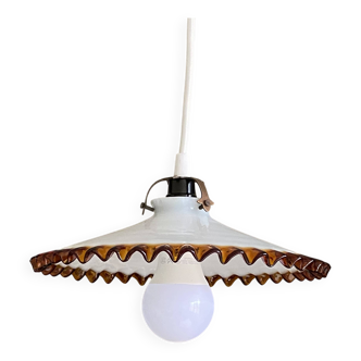 Old pendant light with a white opaline glass shade and a wavy border.