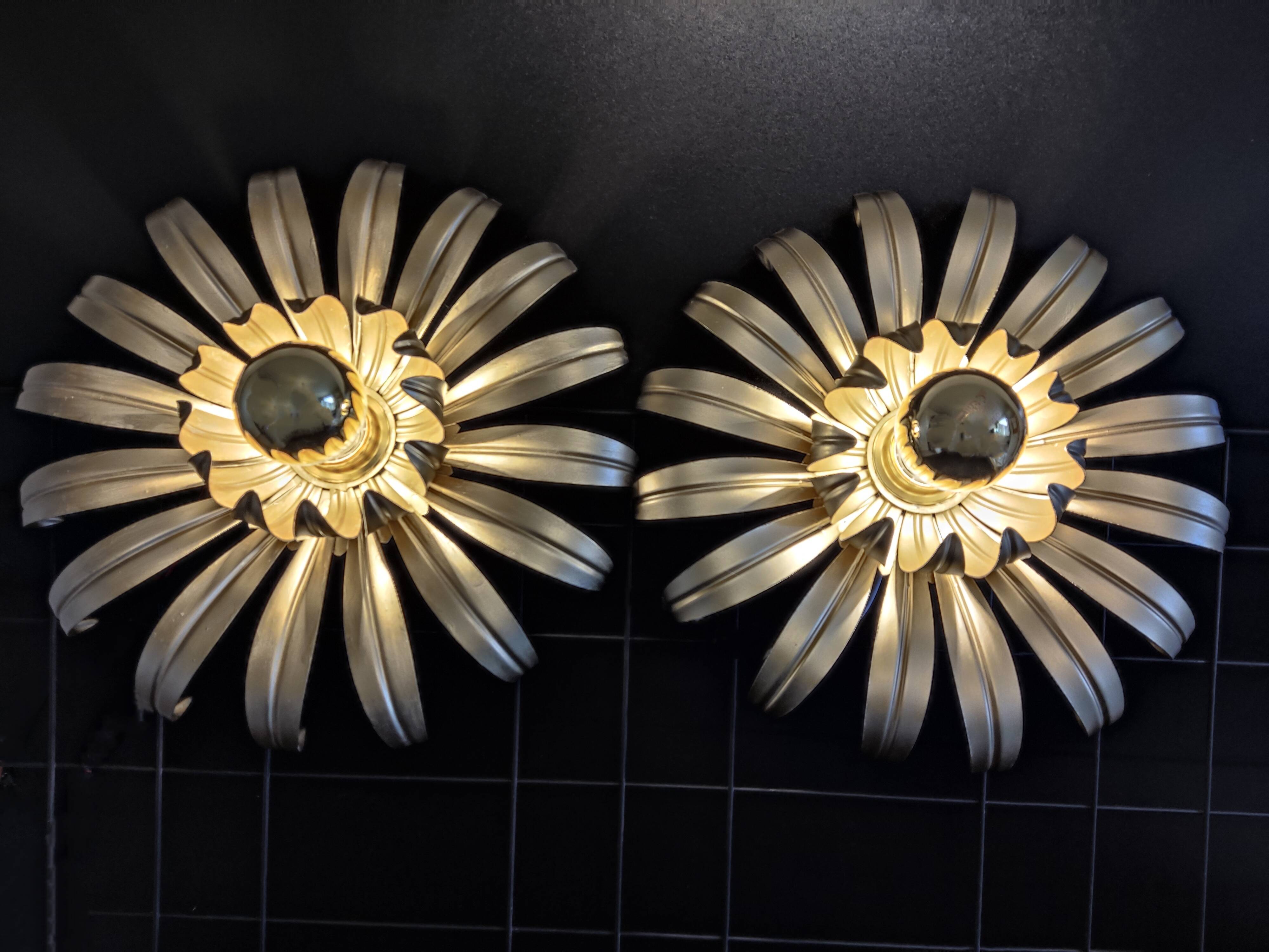 Golden metal flower sconces
