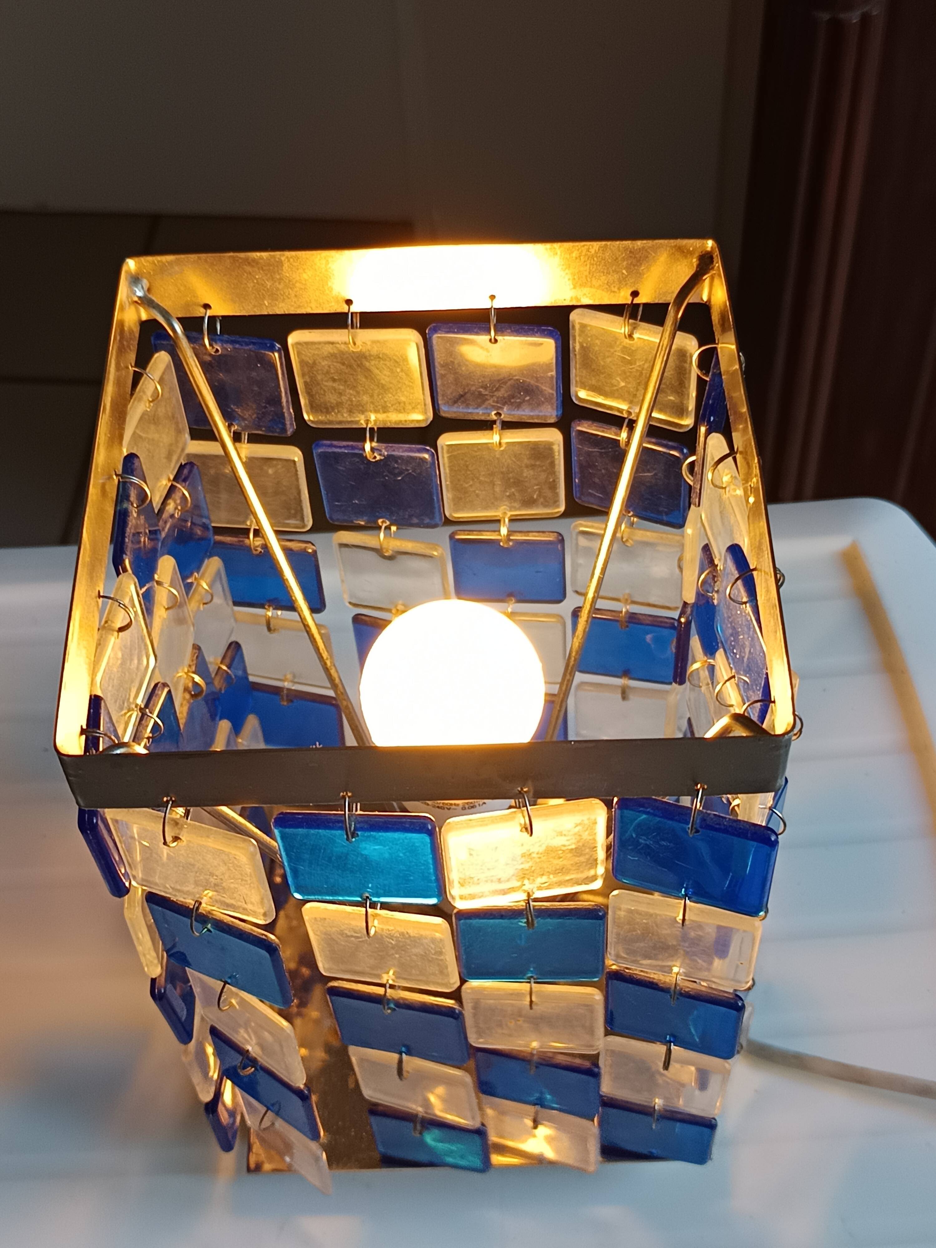 1970s designer table lamp with blue and clear plexiglass pendants.