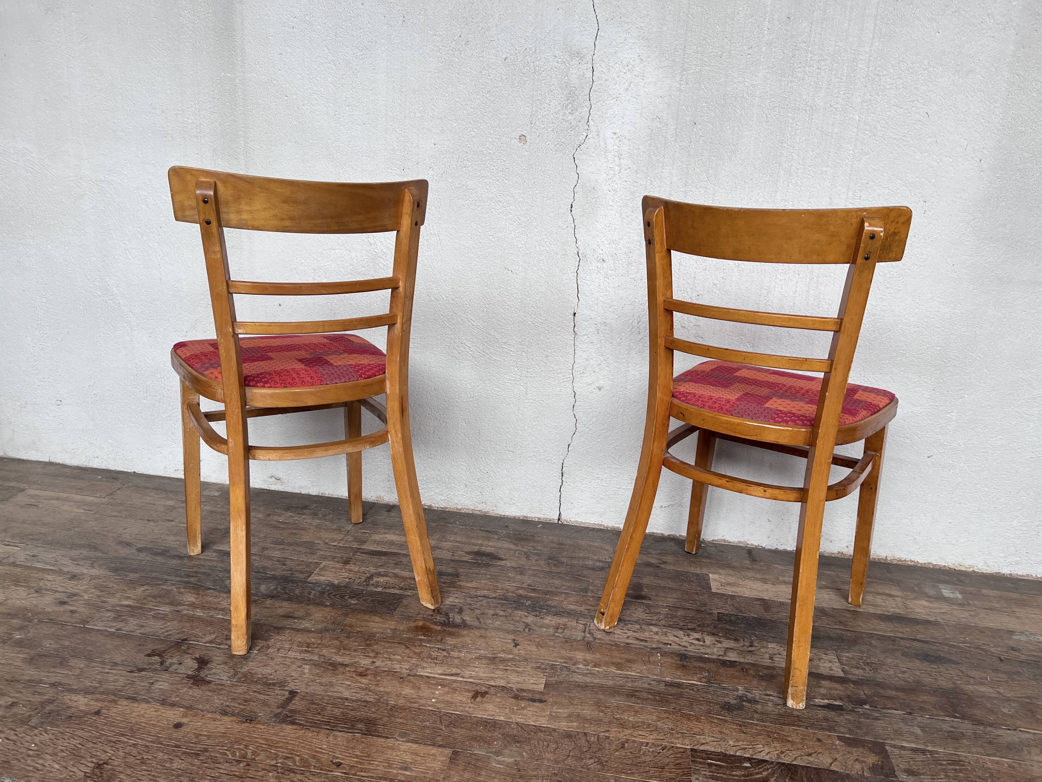 Pair of chairs in light wood and vintage red fabric 1960