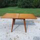 Extendable table with compass legs