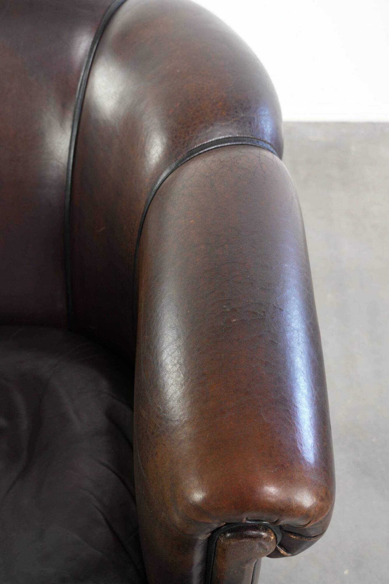 Set of a sheepskin sofa together with its matching club armchair