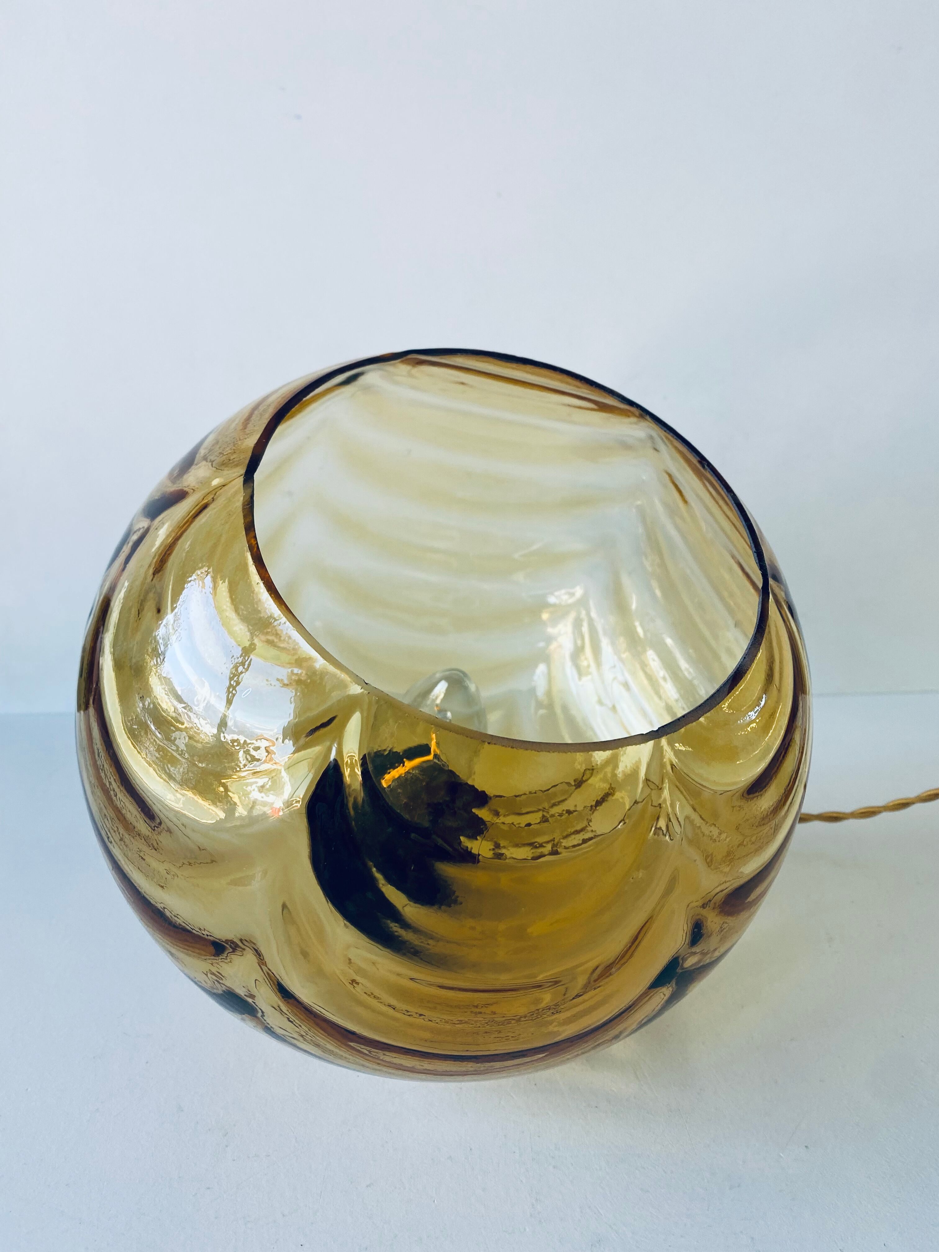 Amber glass ball suspension