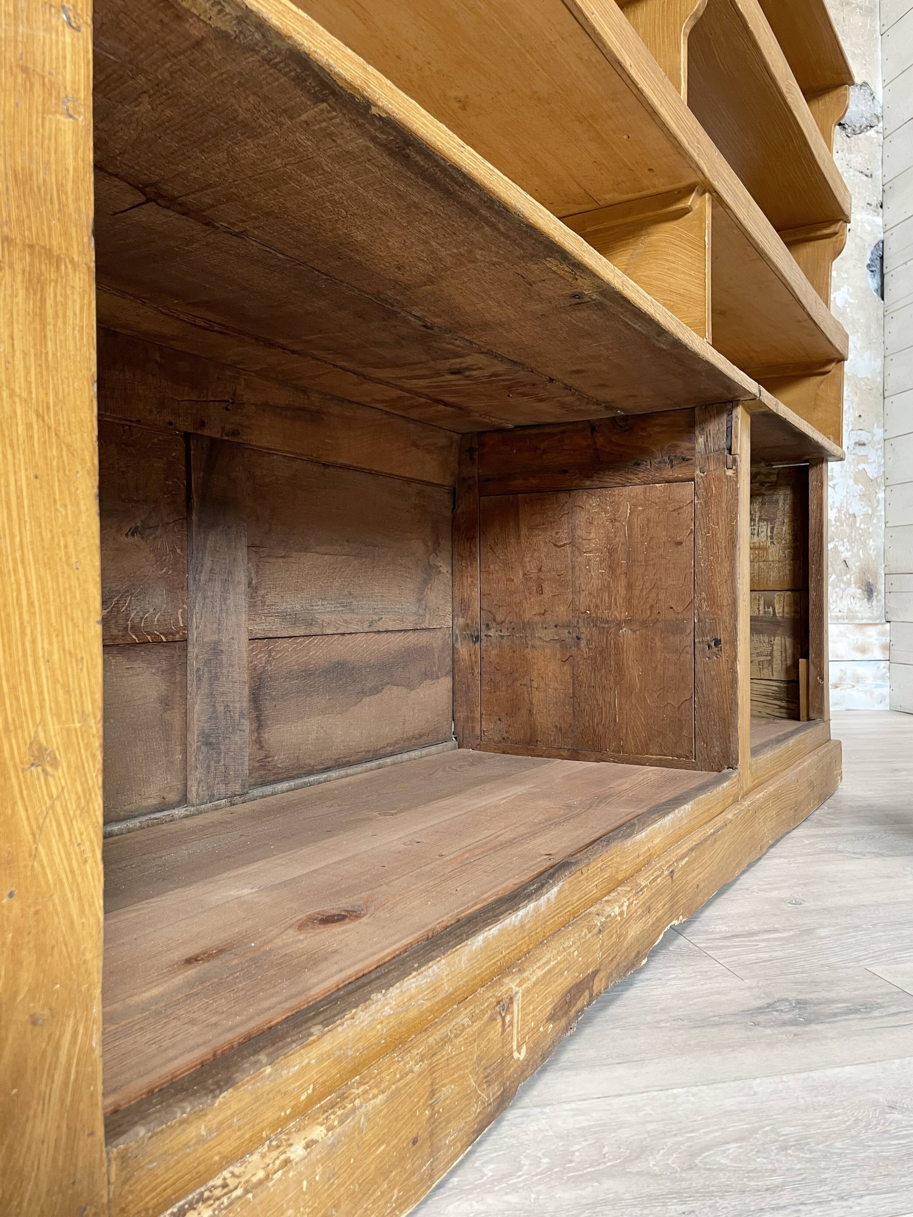 Wooden hardware cabinet painted with wood effect, circa 1940.