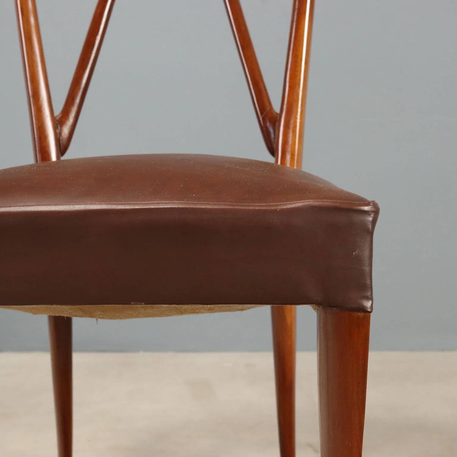 1950s chairs with wooden backs.
