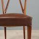 1950s chairs with wooden backs.