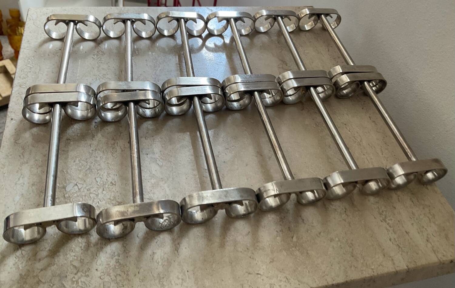 Series of 12 vintage stainless steel knife holders