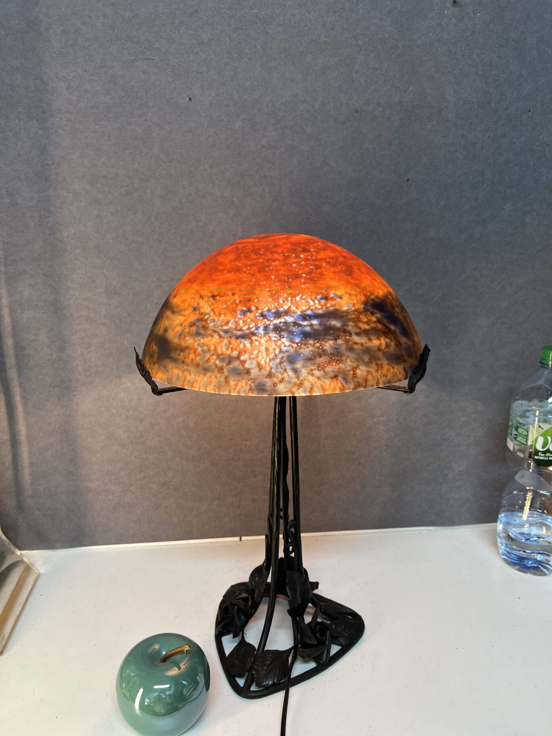 Contemporary mushroom lamp, wrought iron base and shaded orange glass shell