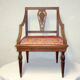 A Chair from the beginning of the 20th century in natural wood.