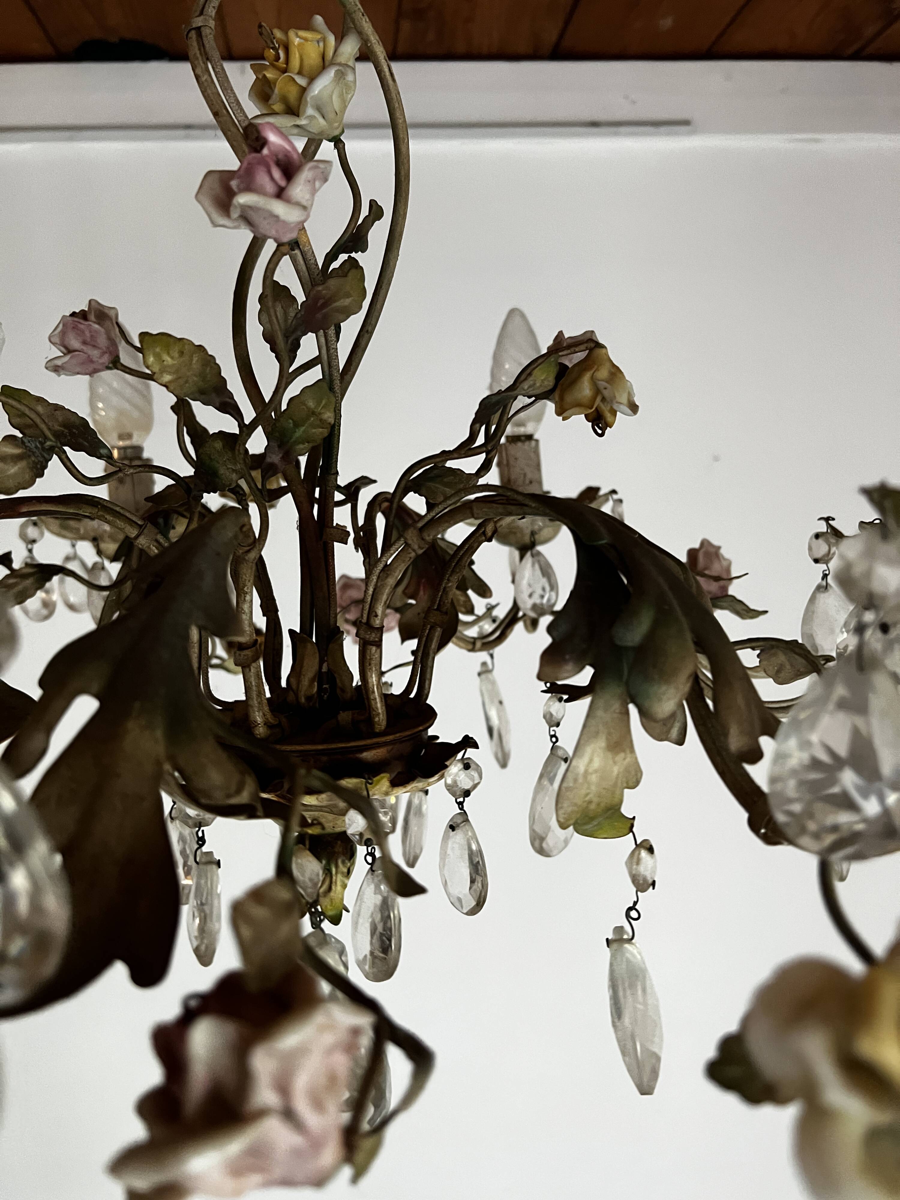 Chandelier with a floral porcelain decoration and pendants