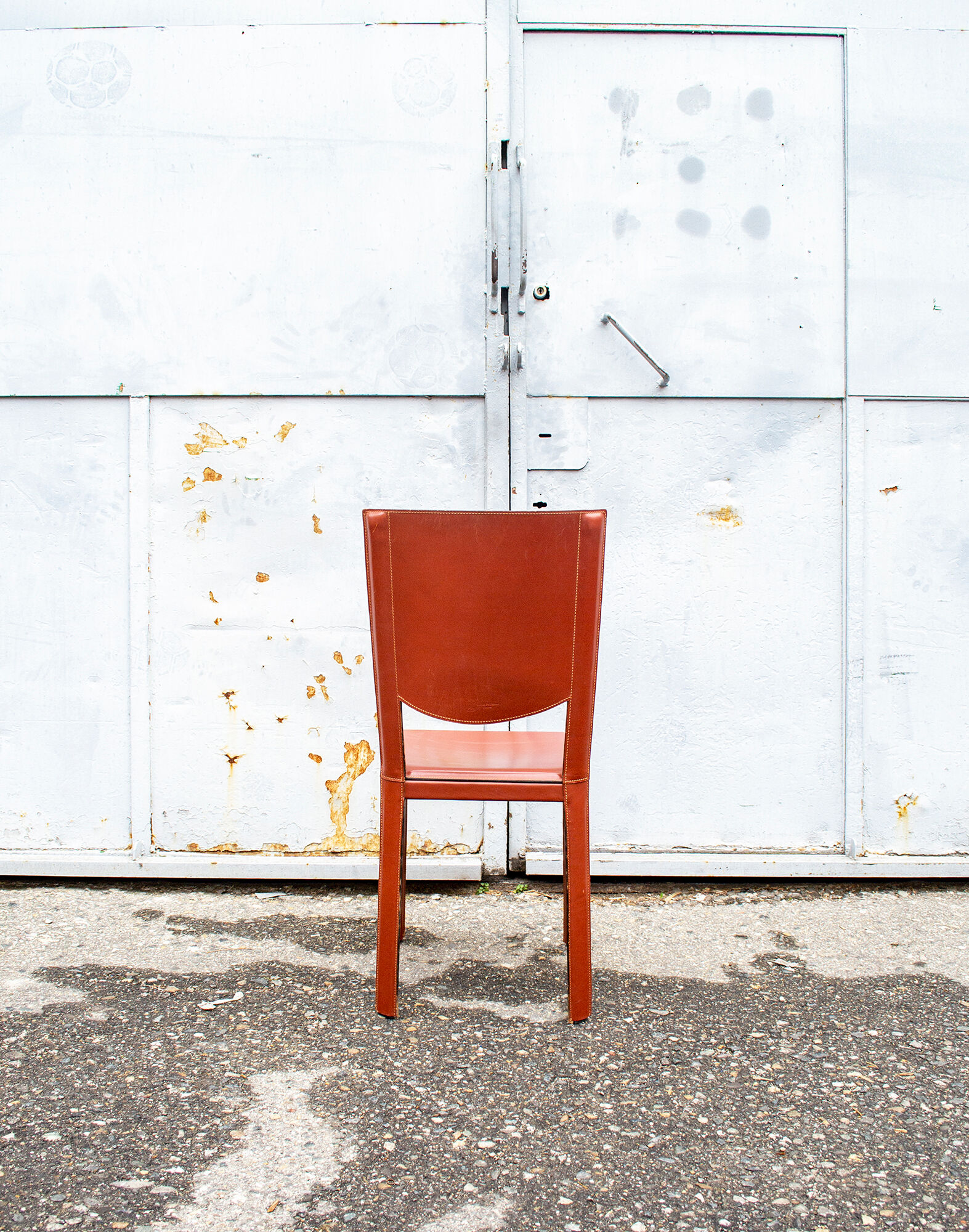 Set of four leather chairs by Enrico Pellizzoni 70s