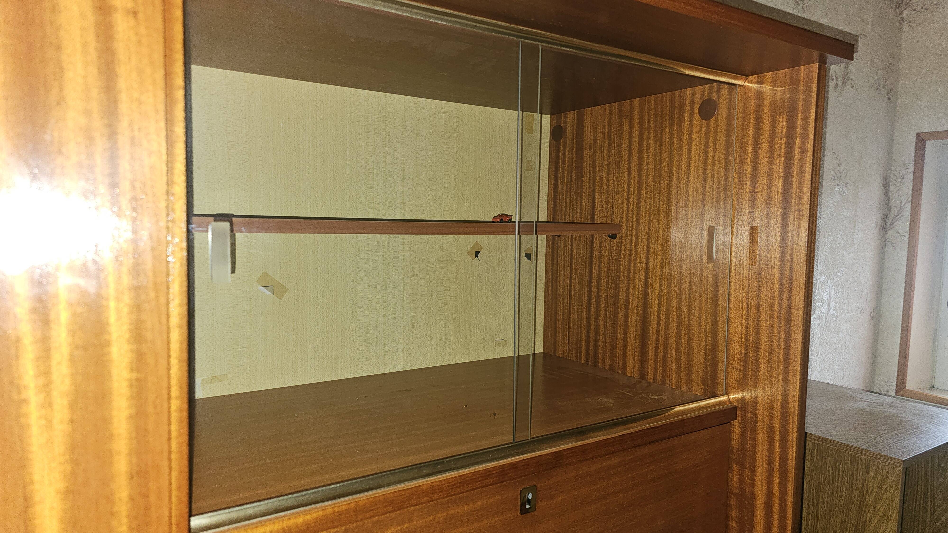1960s teak veneer secretary with sliding display cabinet.