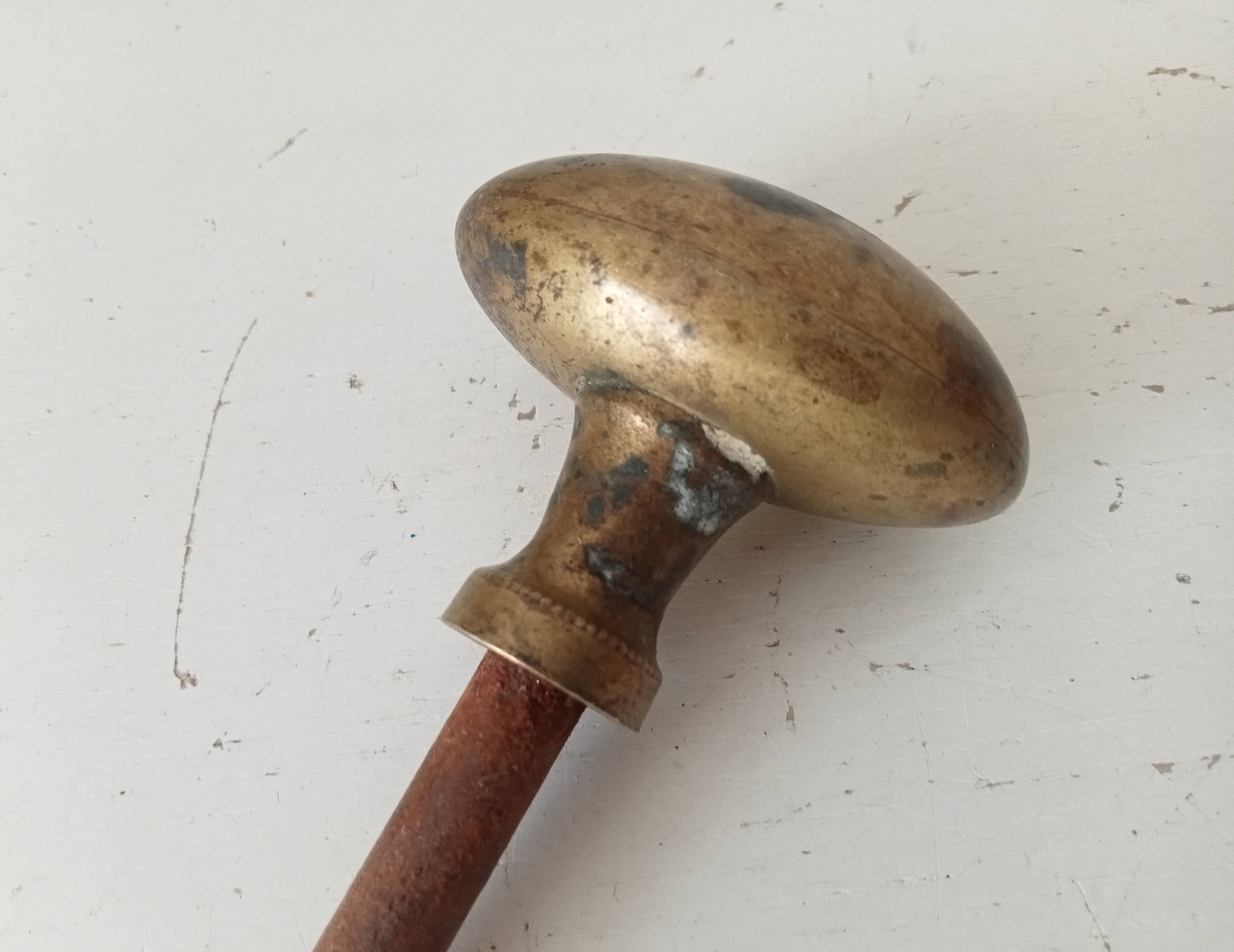 Antique olive door handle from the 19th century.