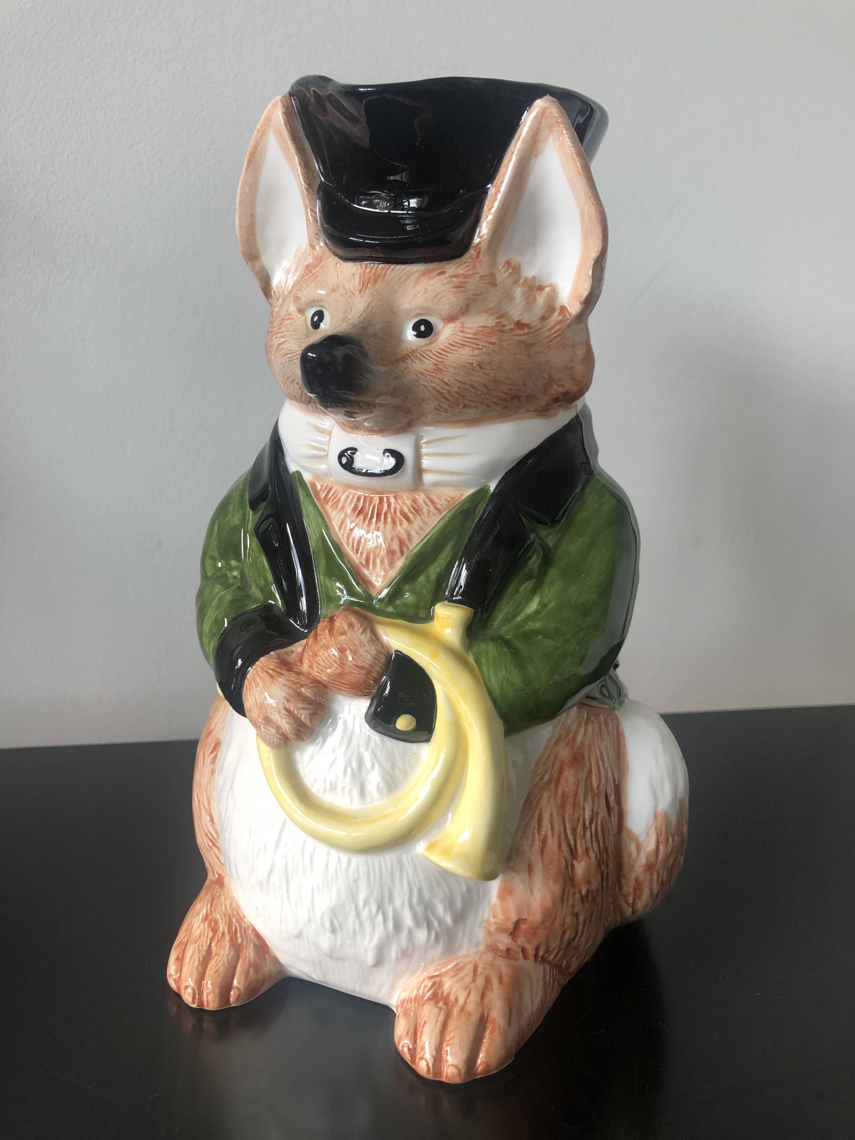 Ceramic jug representing a fox in hunting attire date 1986