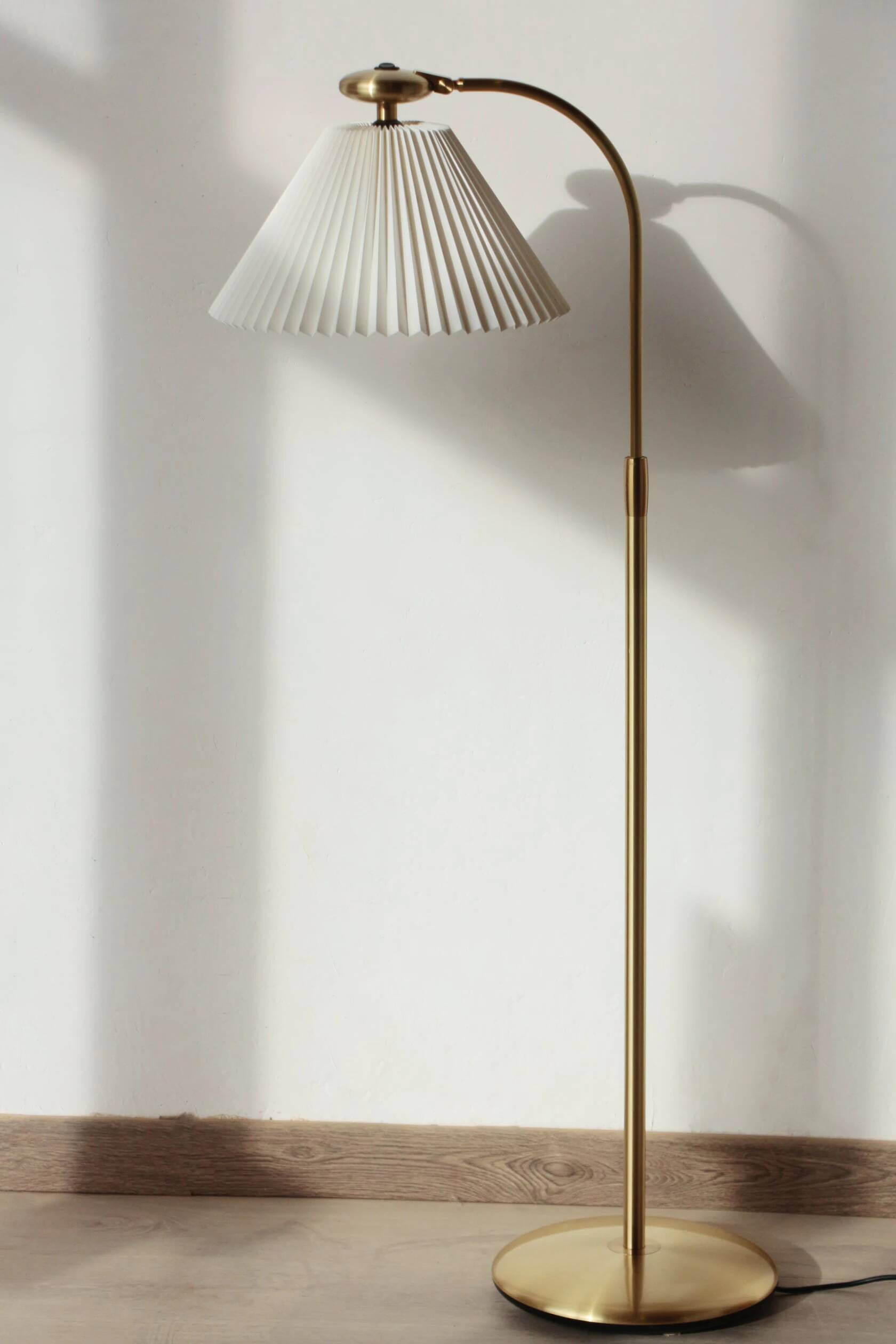 Le Klint 340 floor lamp in brass – design by Philip Bro Ludvigsen