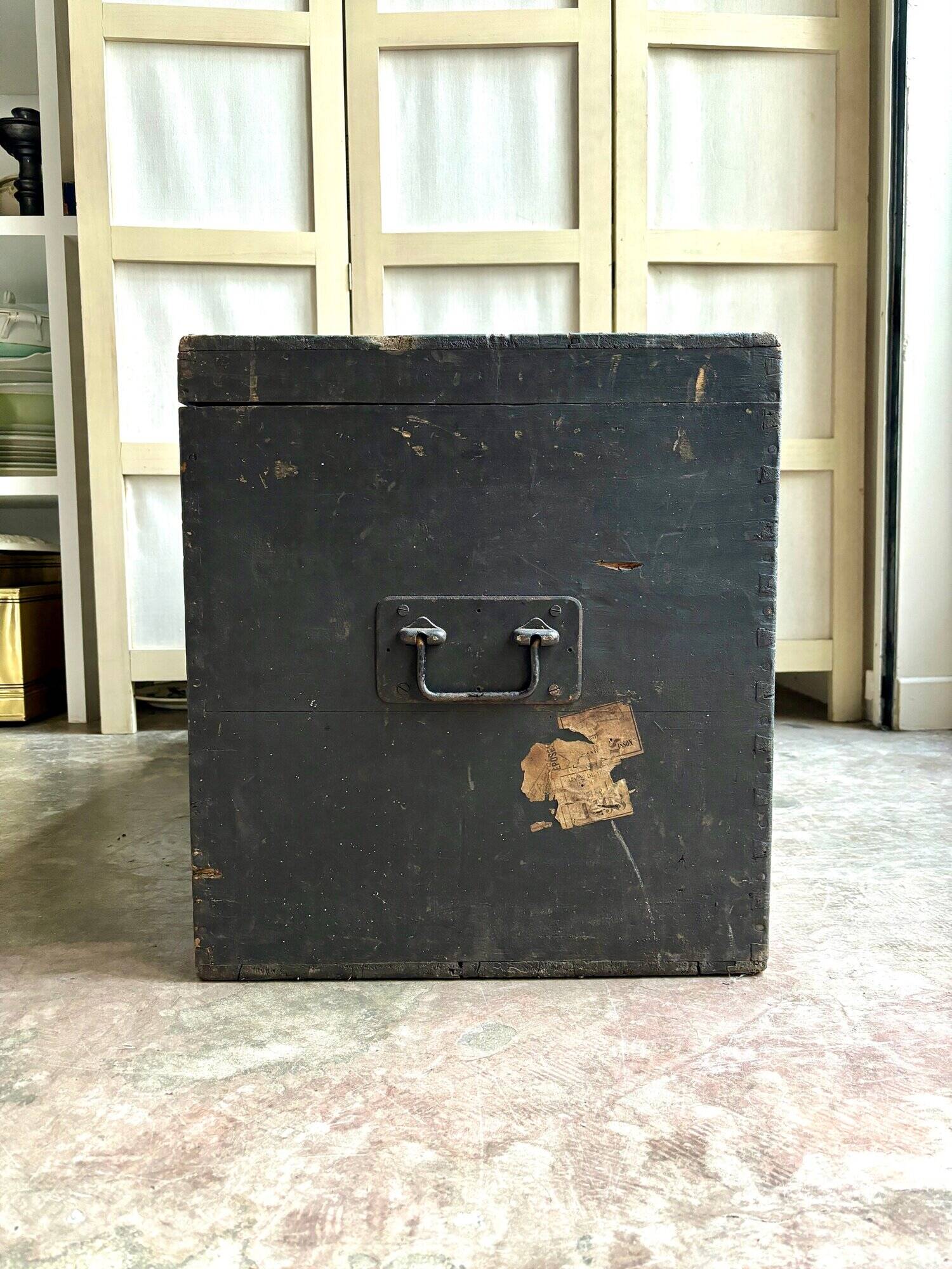 Trunk, black wooden chest and wallpaper