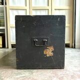Trunk, black wooden chest and wallpaper