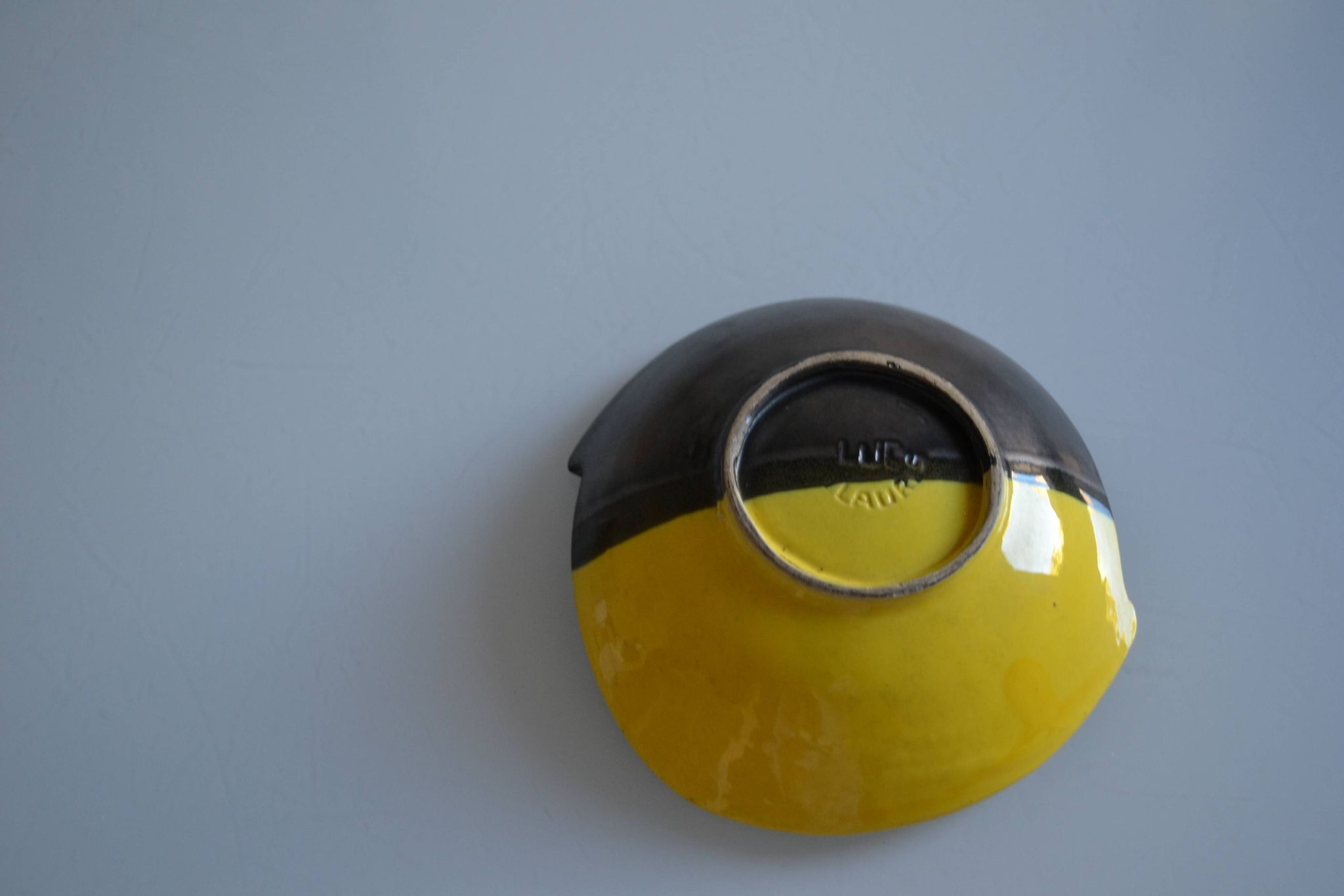 Bicolour ceramic cup in black and yellow signed Luc Vallauris 1950