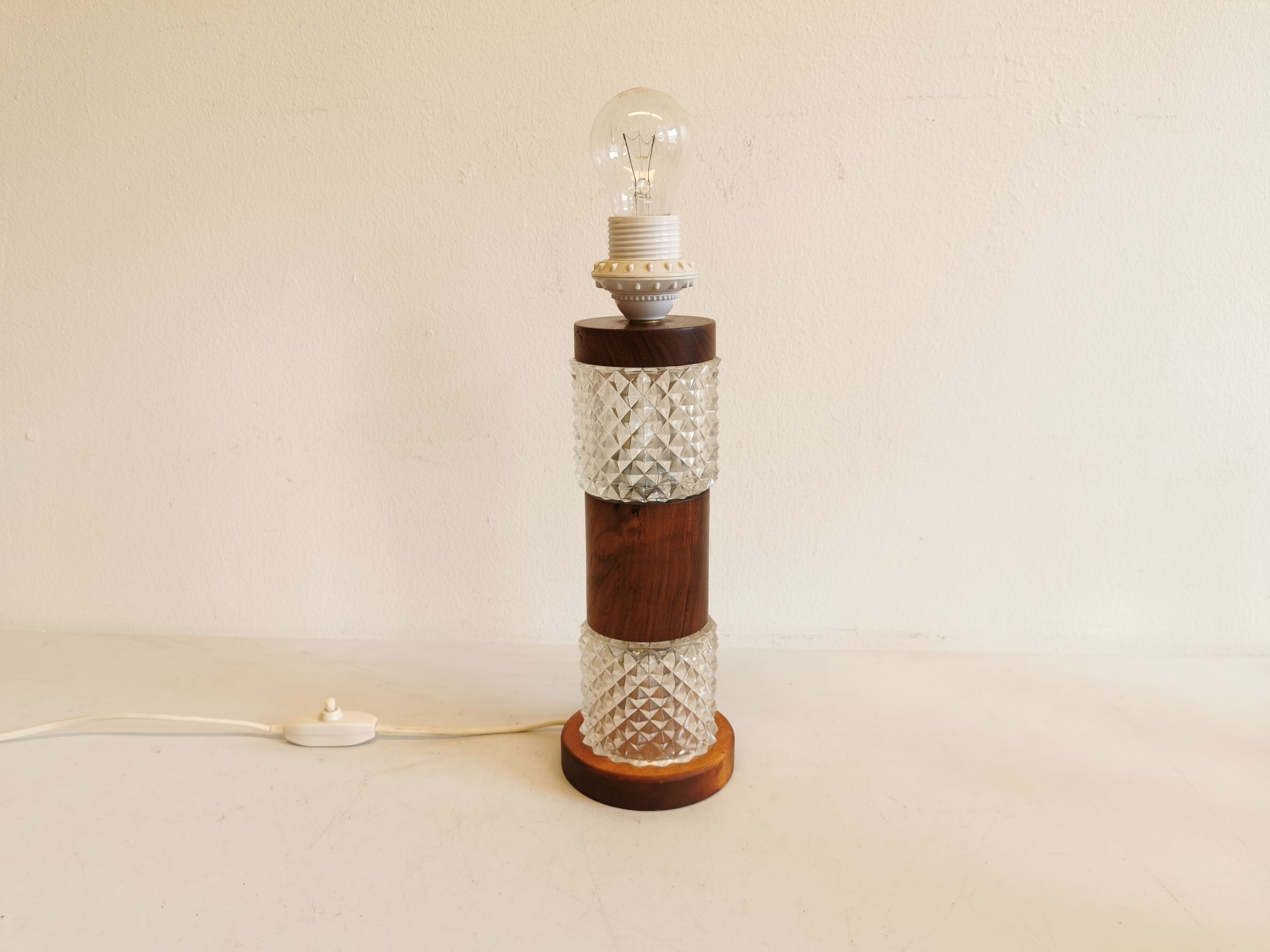 Swedish table lamp, made of what looks like rosewood and crystal glass.