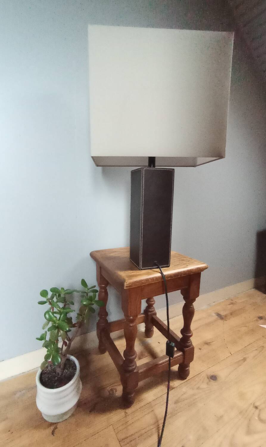 Tall cubic brown leather lamp, light gray fabric lampshade