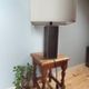 Tall cubic brown leather lamp, light gray fabric lampshade