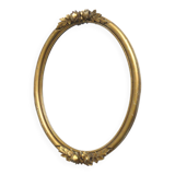 Oval mirror in gilded wood